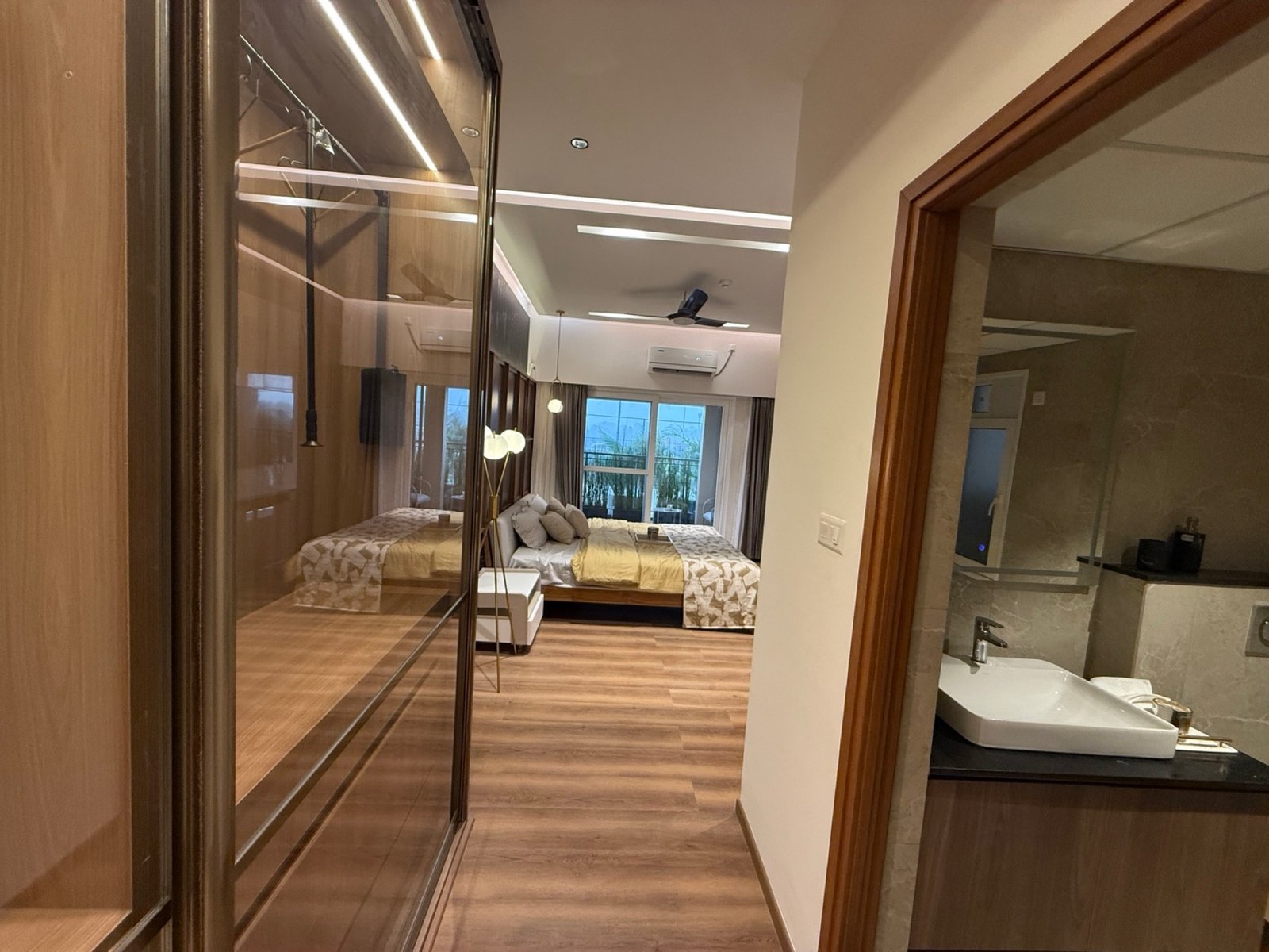 Bedroom with integrated wardrobe and lighting