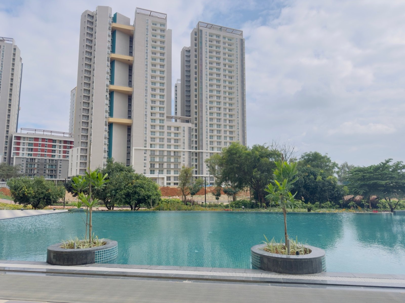 Mana Scanda residences across landscaped water